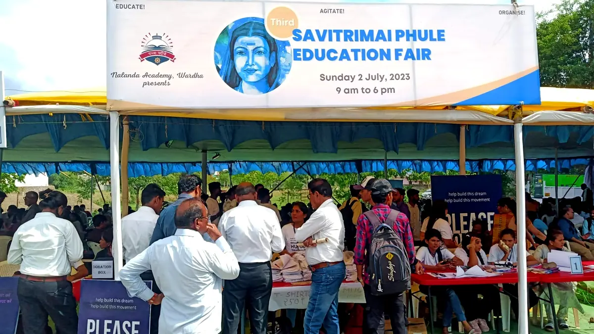 Nalanda volunteers and guests at the registration desk